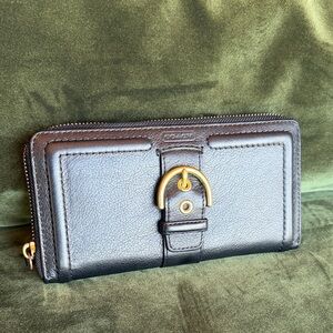 Like New- Coach Black Leather Zip-Around Wallet with Gold Buckle Accent.